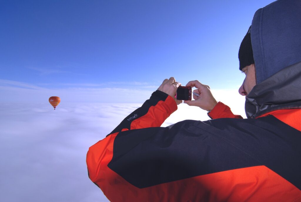 Client in a hot air balloon high above the Czech Republic
