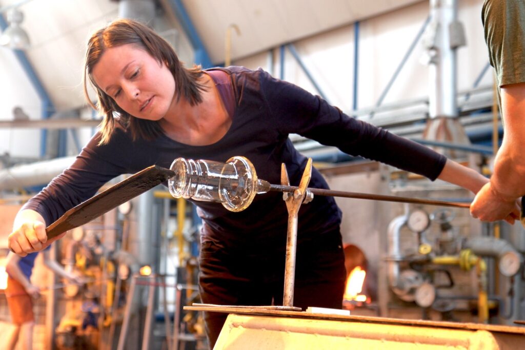 Client working on her beer glass during the workshop, Czech Republic